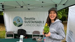 Nicolette McCary works the Seattle Sustainable Landscapes booth at the Tilth Alliance Edible Plant Show in May 2024.