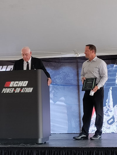 Lake Zurich Mayor Tom Poynton presented Harold Redman, President and CEO of ECHO Inc., with the Green Business Award at ECHO's Power-On-Athon.