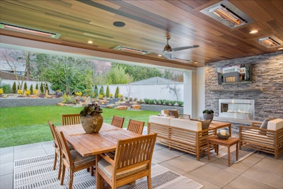 Outdoor amenities—like this open patio featuring Eldorado Stone’s Stacked Stone in Silver Lining—help blur the boundaries between indoors and out, creating seamless, multi-use living spaces.
