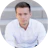 Professional man in white shirt looking directly at camera Headshot