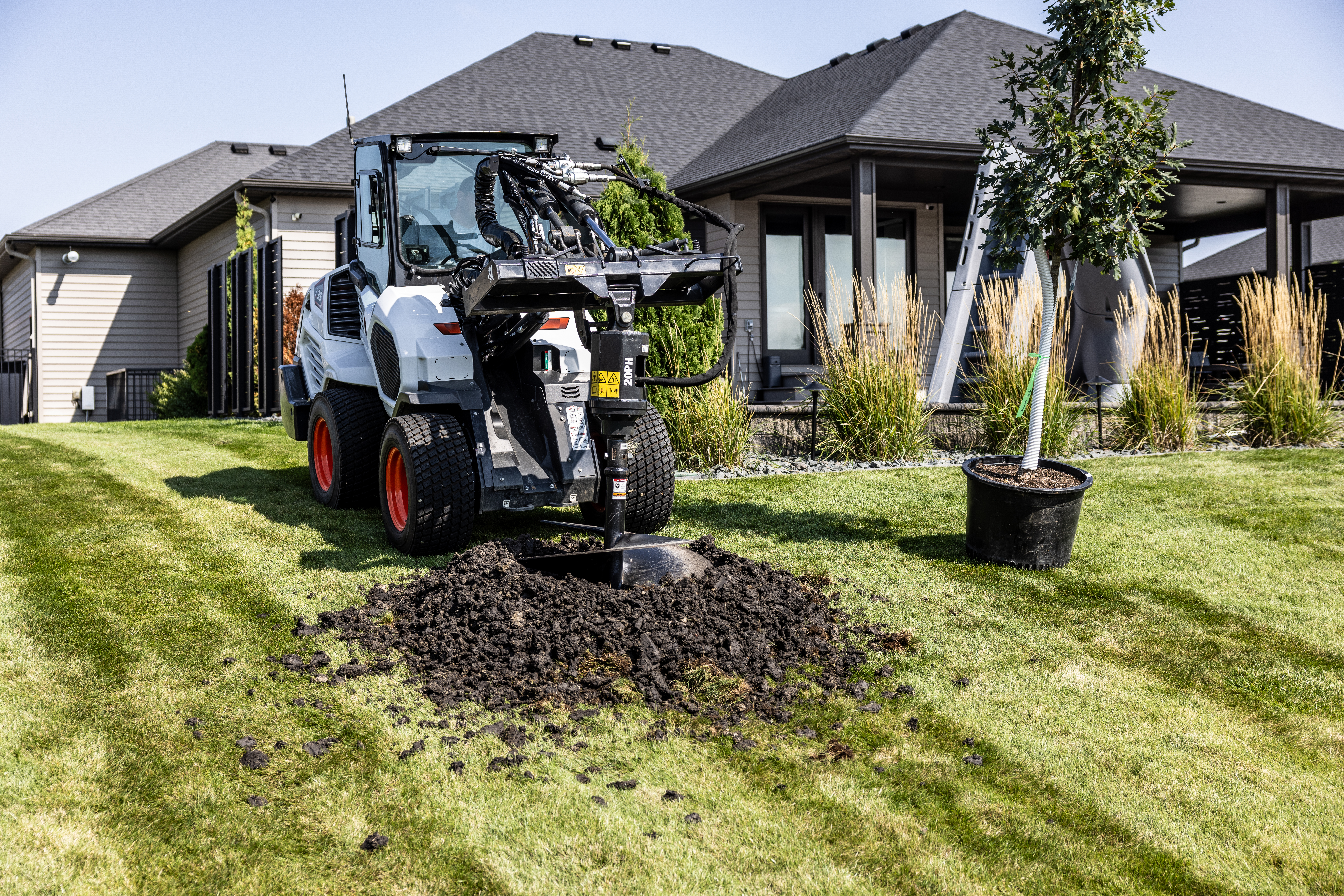 With compatibility for a wide range of attachments, small articulated loaders like the Bobcat L35 here help pros tackle the next job - whether that be brick and paver installation, sod work, tree care, nursery management, fencing construction, material handling or snow removal.