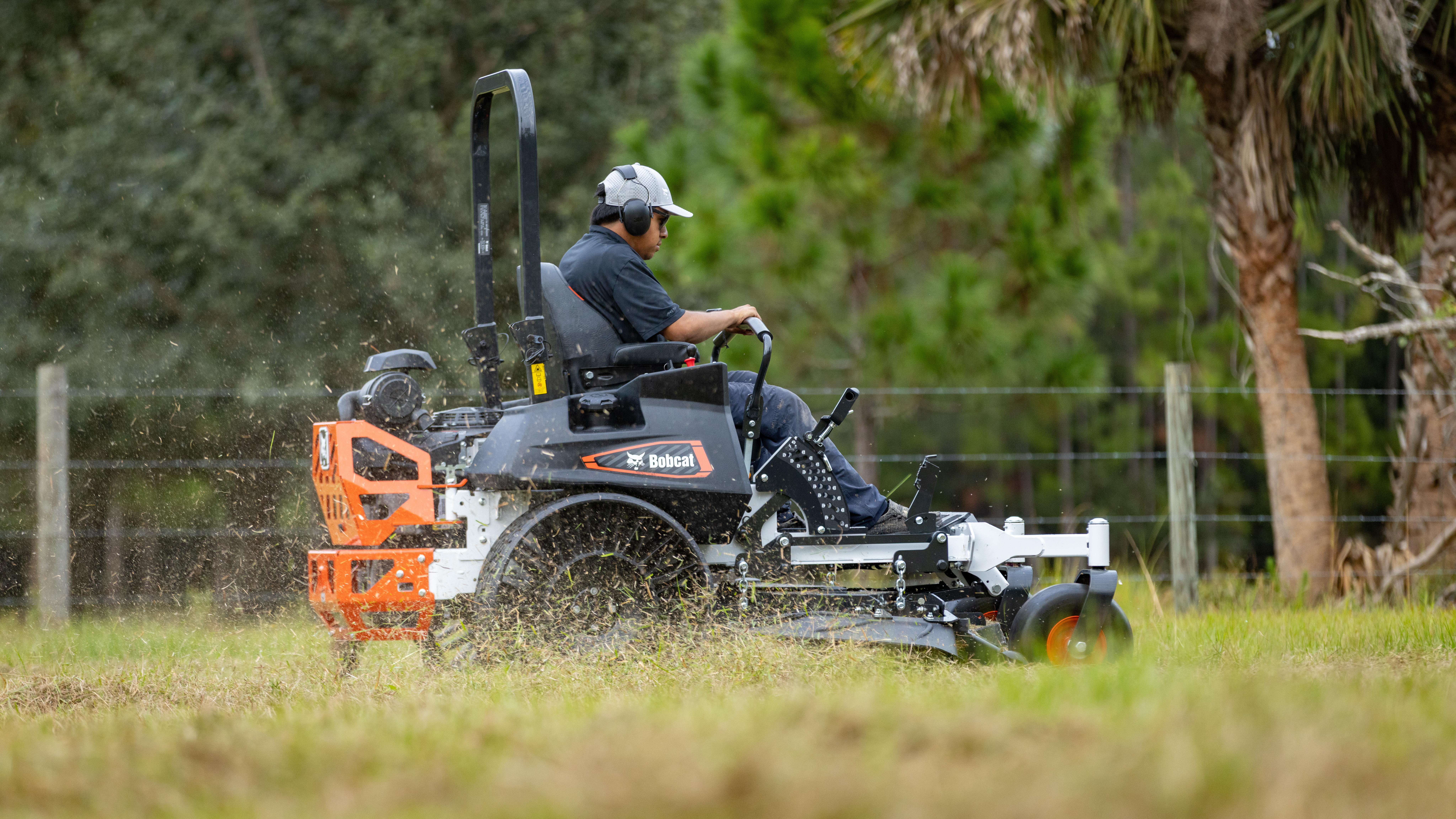 Engineered for high-demand commercial work, the Bobcat ZT7000 zero-turn mower pairs a heavy-duty drive system, advanced cutting technology with engine options suited for long lawn-mowing days.