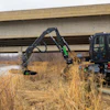 A landscaper using a DM360 for roadside maintenance.