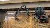 A landscaper using a DM360 for roadside maintenance.