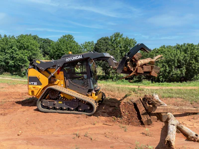 With a frame size suited for a variety of landscaping, residential contracting, municipal and residential applications, the Hyundai HT30 compact track loader is available from the factory in any of three versions: cab with high-flow, cab with standard flow, and canopy with standard flow.