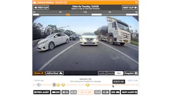 Dashcam footage of highway traffic showing white sedan, dark vehicle, and cement truck on multi-lane road with video timeline interface