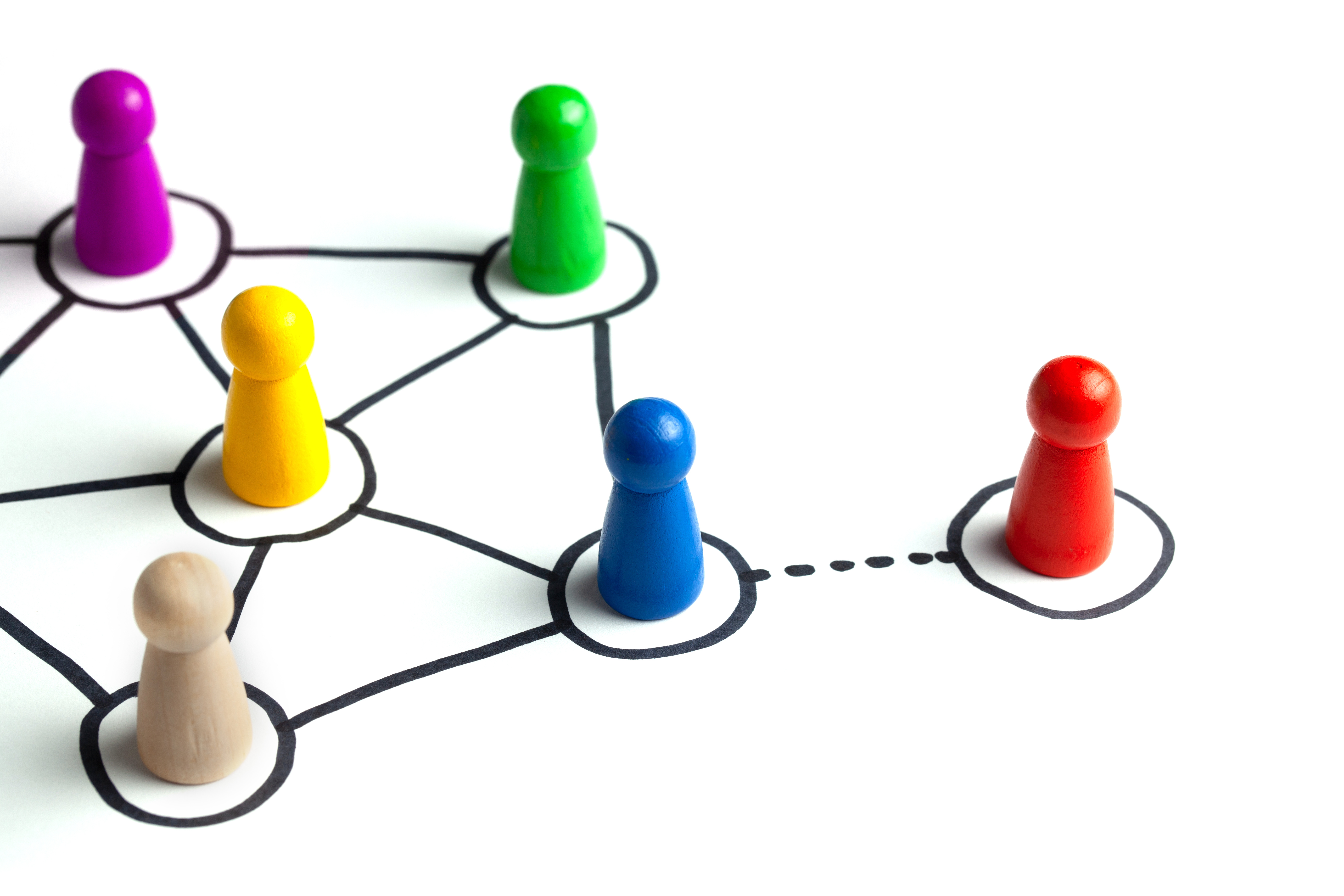 Colorful game pieces connected by lines representing a network or organizational structure diagram