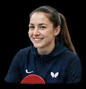 Smiling athlete wearing navy Butterfly sports hoodie with Nike logo