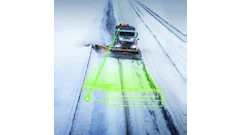 Snow plow truck clearing highway with neon green detection zone overlay during winter storm