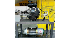 Industrial engine and air compressor equipment displayed on metal platform with technical specifications and Vanguard branding