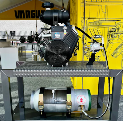 Industrial engine and air compressor equipment displayed on metal platform with technical specifications and Vanguard branding