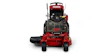 Red and black Ferris zero-turn radius lawn mower with front-facing view showing cutting deck and engine