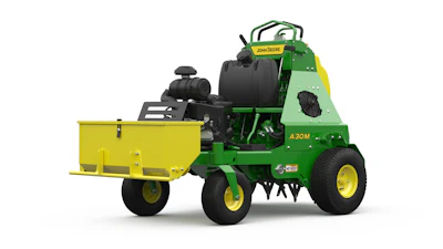 John Deere A30M green and yellow riding mower with attached utility trailer