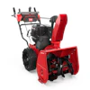 Red and black Toro two-stage snow blower with engine and chute on white background