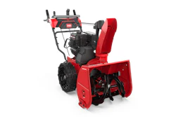 Red and black Toro two-stage snow blower with engine and chute on white background