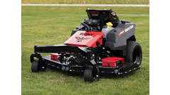 Red and black Gravely zero-turn radius mower on grass field