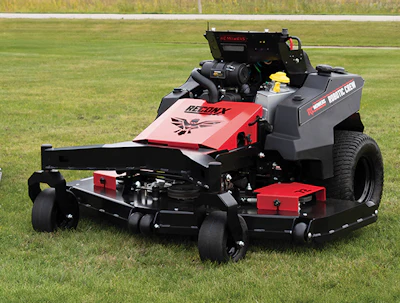 Red and black Gravely zero-turn radius mower on grass field
